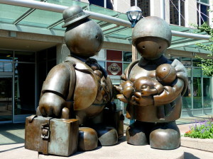 Immigrant family sculpture